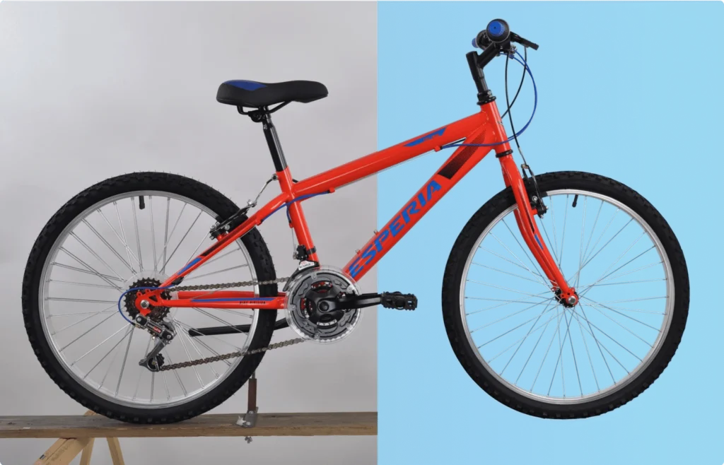 Red Esperia mountain bike with black seat and tires, displayed on split gray and blue background.