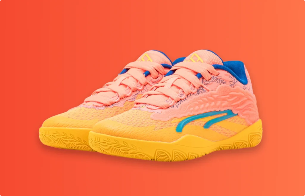 Colorful sports sneakers in orange, yellow, and blue displayed on an orange background